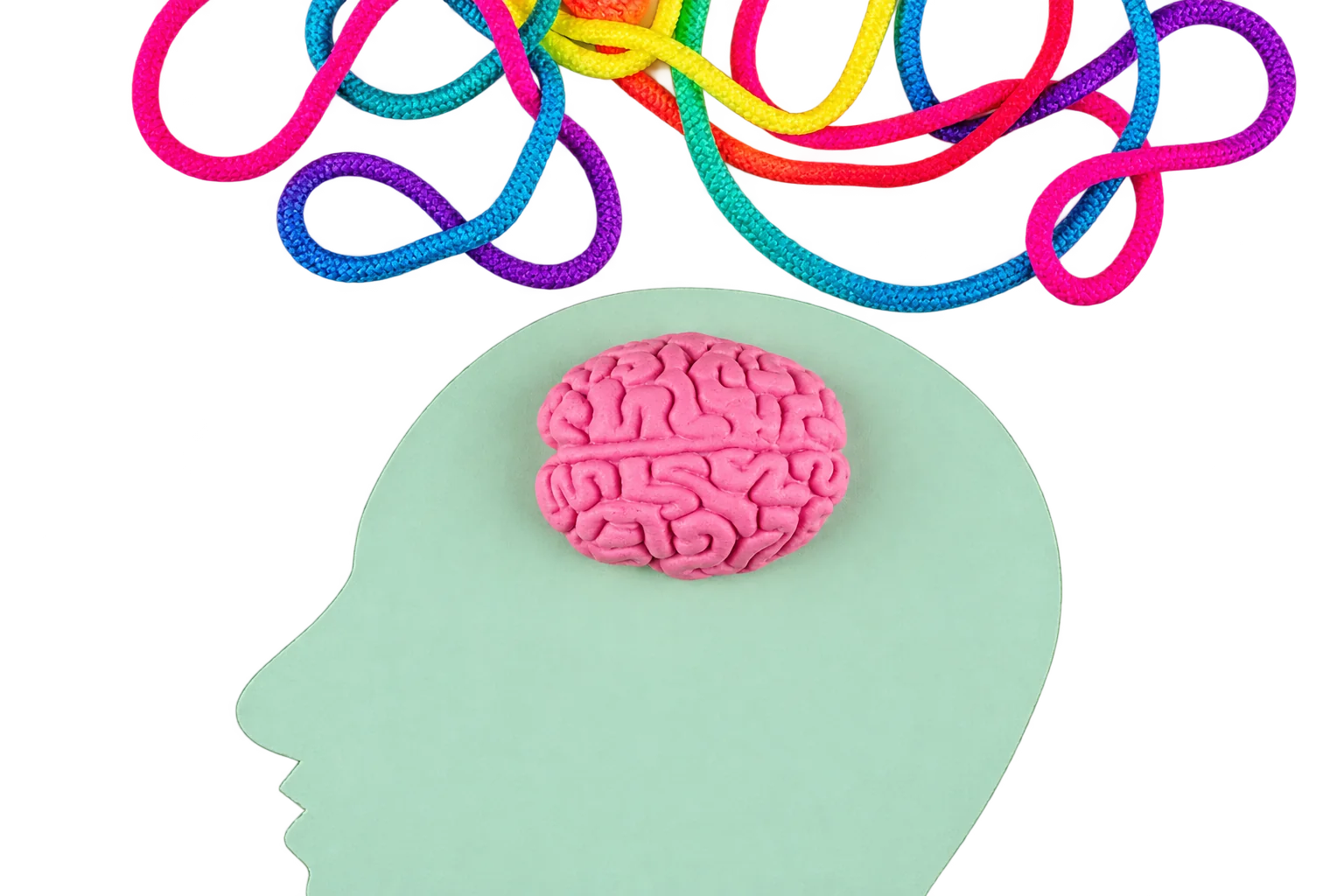 Silhouette de tête verte avec cerveau rose et cordons colorés emmêlés